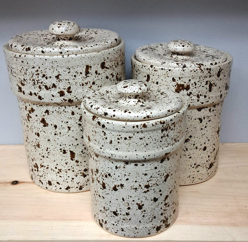 Set of three ceramic canisters with speckled glaze (Texas)